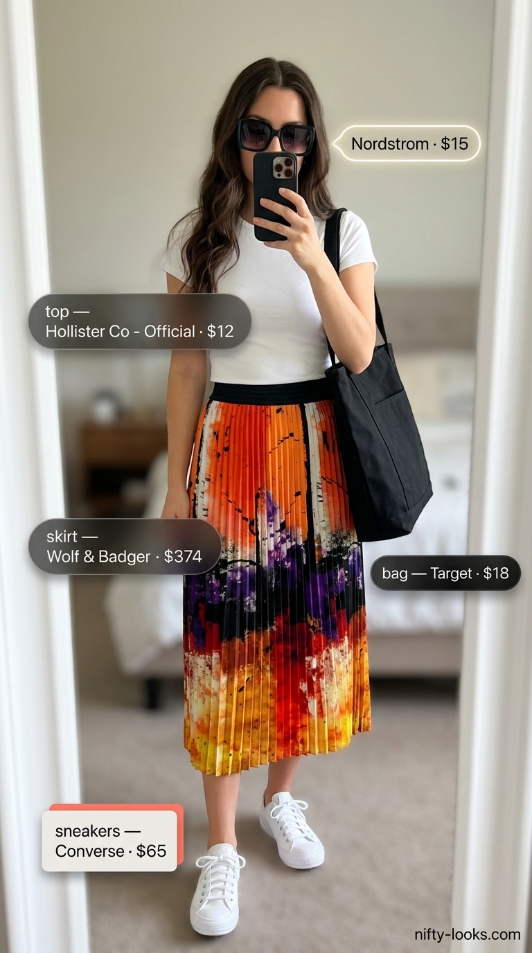 Sporty chic summer outfit for women: Abstract print midi skirt, white tee, canvas tote, and white sneakers.