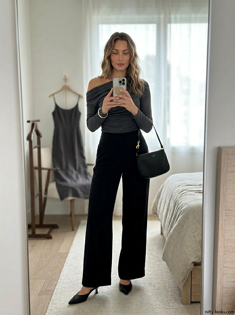 Chic asymmetric outfits for women 2026: Charcoal knit top, black wide-leg trousers, heeled mules.