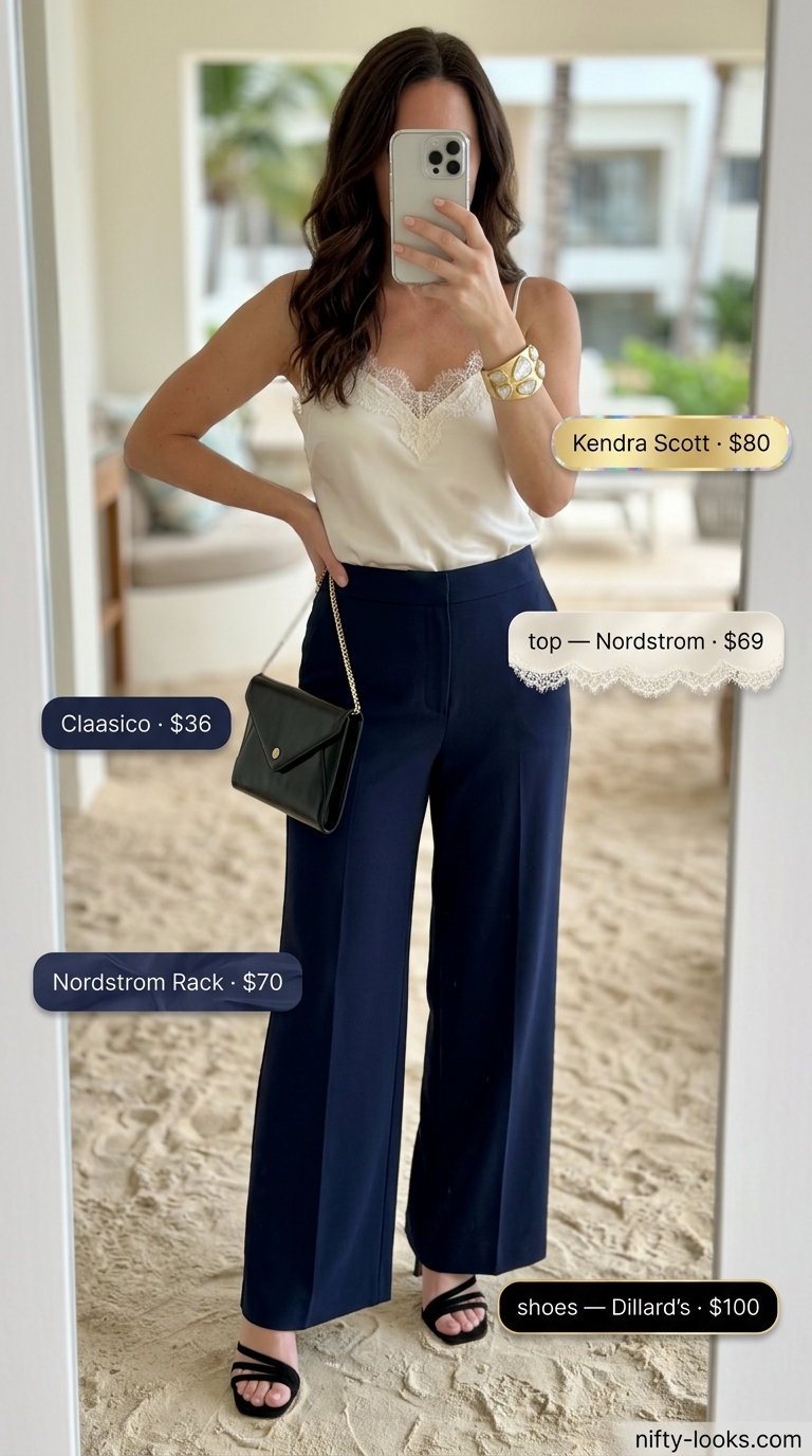 Navy wide-leg pants and ivory camisole for summer beach vacation outfits for women 2026. Elegant and sophisticated.