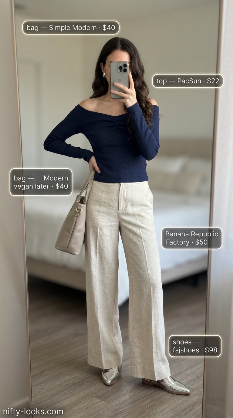 Chic navy off-shoulder knit top with cream wide-leg trousers and metallic mules.