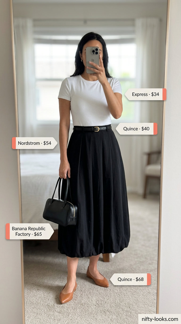 Chic midi skirt outfit for women over 30: black skirt, white tee, tan flats. Trendy summer outfits 2026.