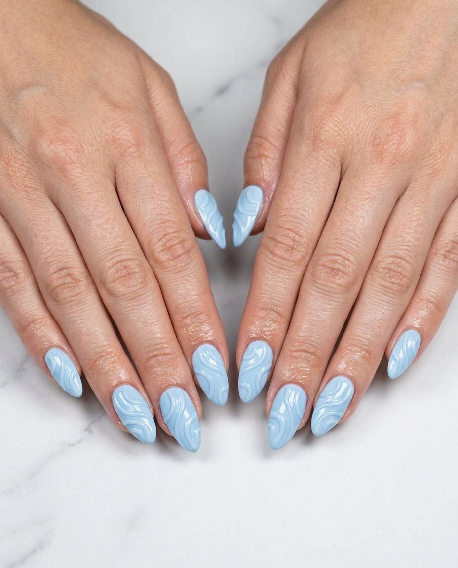 Almond summer nails 2026 for fair skin: Textured sky swirls for a whimsical festival or party look.
