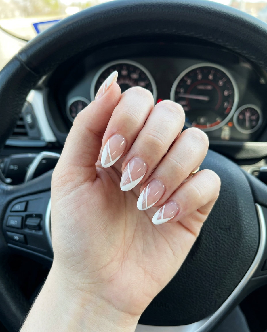 Opaque white negative space lines on almond nails for fair skin, perfect for modern minimalist looks in 2026.