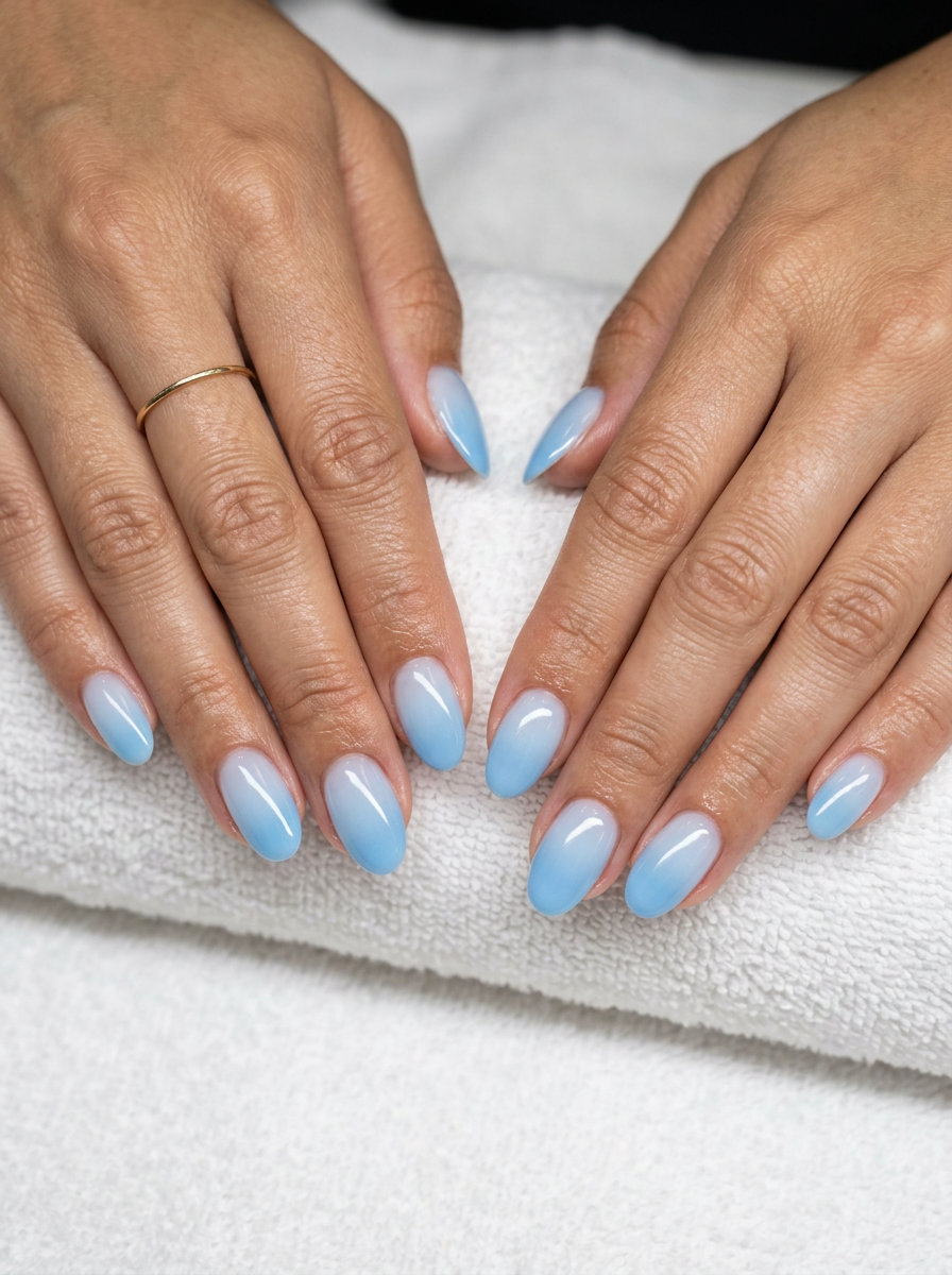 Sky blue gradient aura oval nails for daily wear, summer vacation, and casual outings. Oval summer nails 2026.