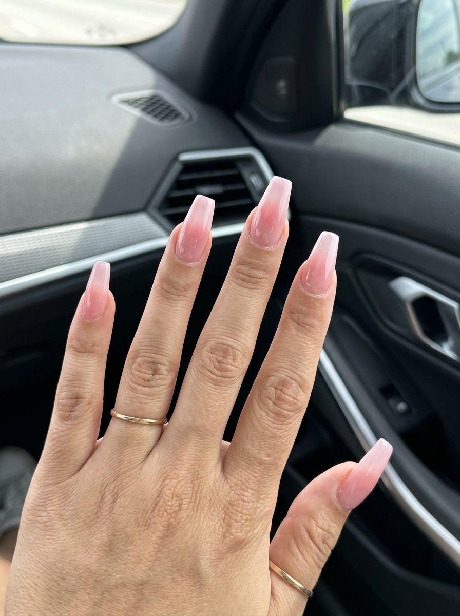 Romantic sheer pink aura soft coffin nails for weddings. Simple summer acrylic nail designs 2026.