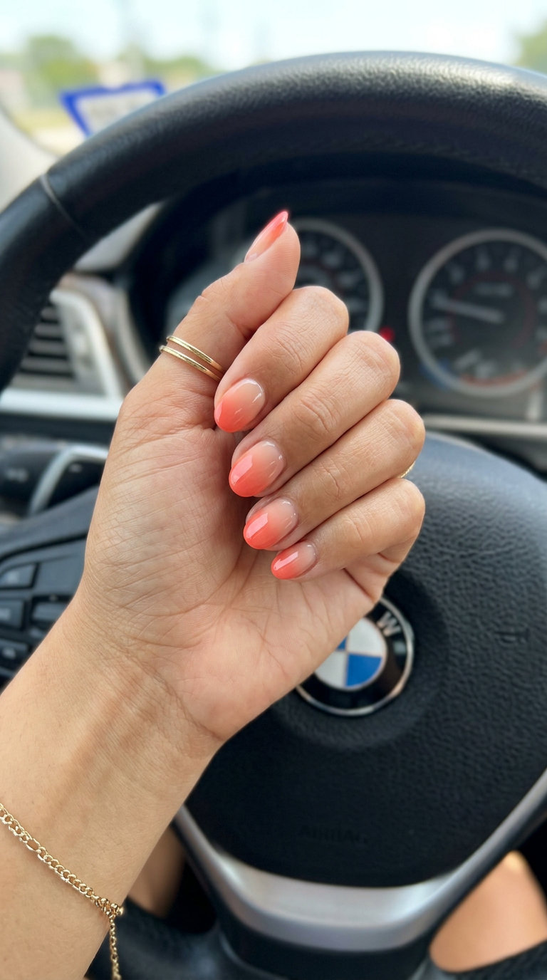 Short oval summer nails 2026: Glamorous sunset coral ombre for parties and vacations.