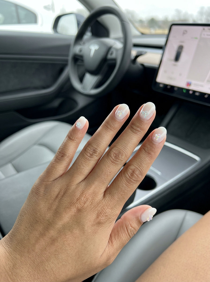 3D Floral Charm Nails 2026 Short round summer nails 2026: Sheer White 3D Floral Charms for vacation and beach parties.