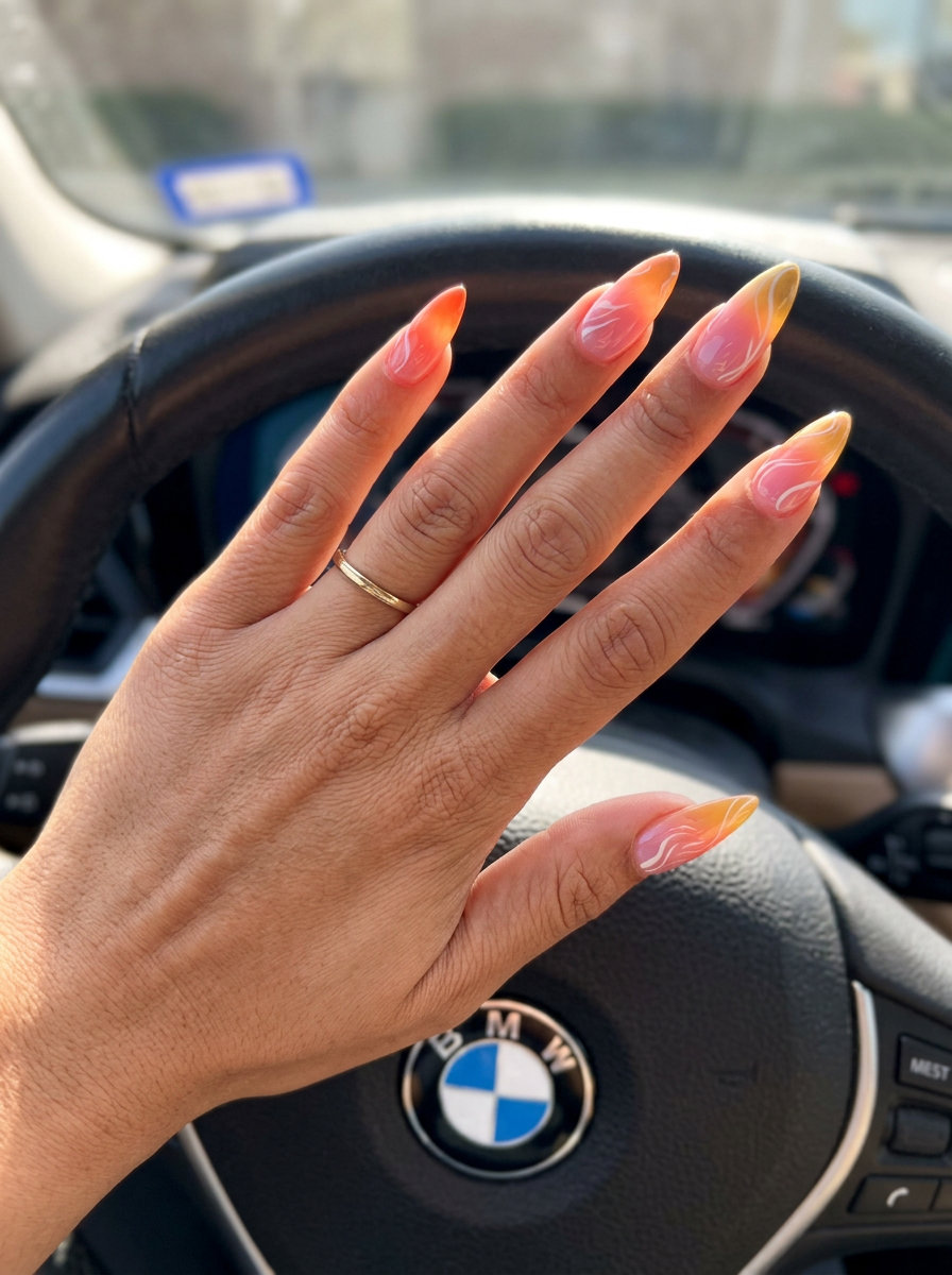 Bohemian gradient sunset swirl stiletto nails for summer vacation and festivals.