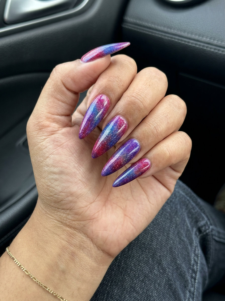 Cosmic Berry Burst Stiletto nails: multicolor berry shades with holographic shimmer for summer fruits nail art 2026.