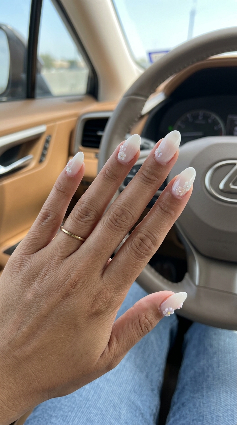 3D floral charms on milky white nails for summer nail manicure ideas 2026, ideal for weddings and special occasions.