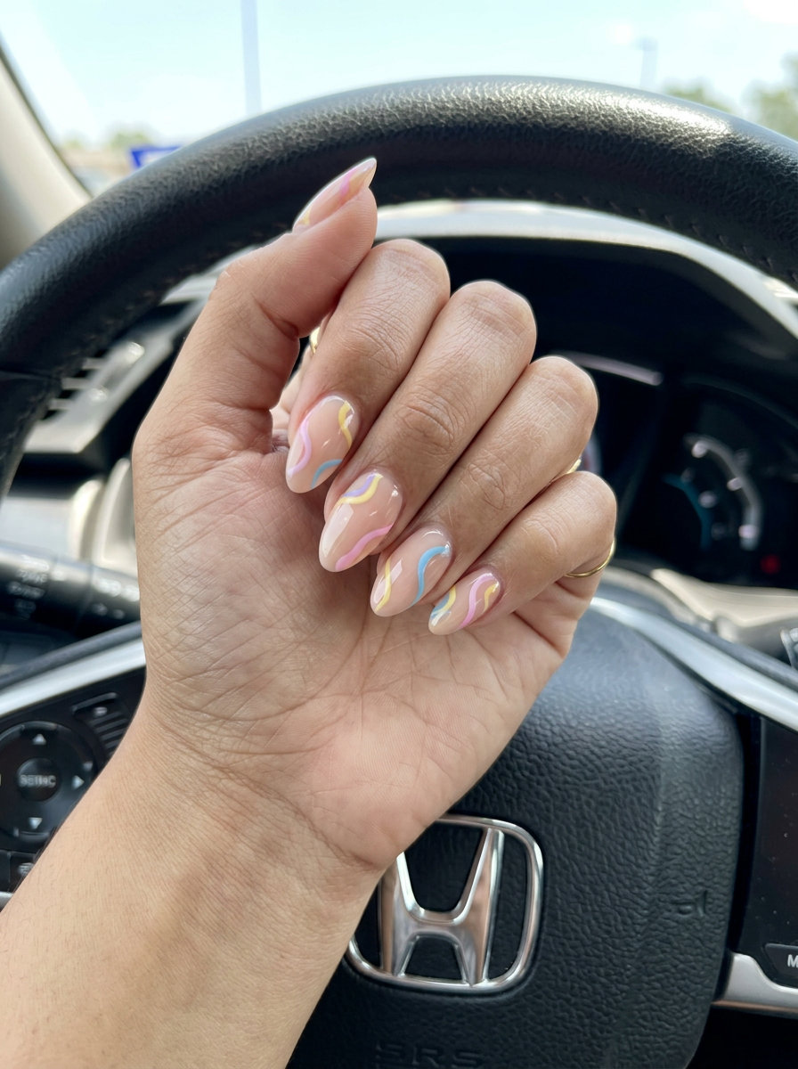 Abstract swirls on a nude base for summer nail manicure ideas 2026, perfect for festivals and casual events.