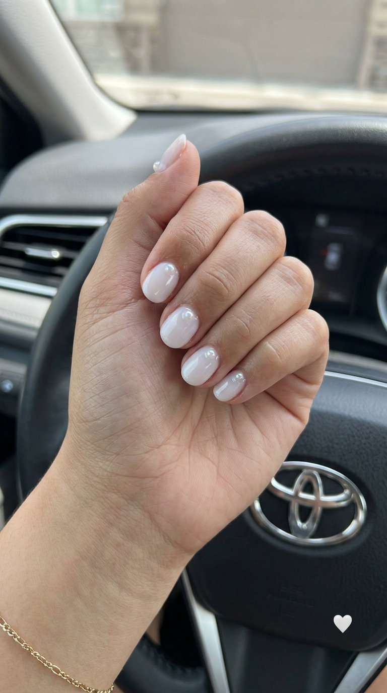 Summer Nails 2026: Romantic Pearl Accents Milky white jelly nails with pearls for summer nails 2026. Romantic and ethereal for weddings and bridal showers.