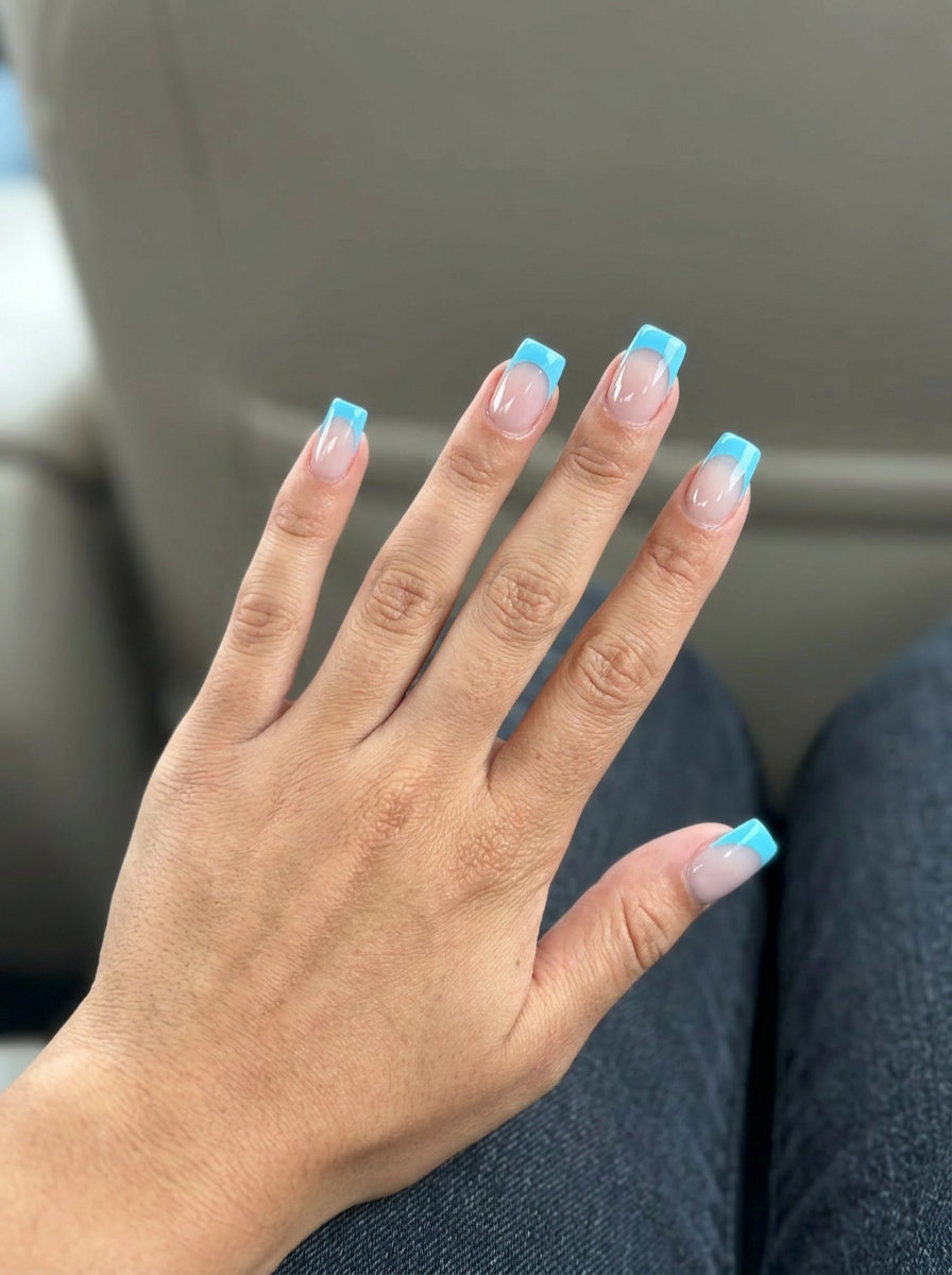 Summer Nails 2026: Sky Blue Negative Space Modern sky blue negative space French nails for summer nails 2026. Clean and playful for casual outings.