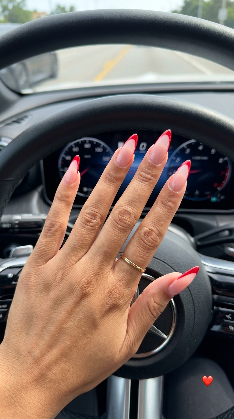 Trending summer nails 2026: Cherry red micro French stiletto nails for parties and summer nights. Sultry, bold, and glamorous.