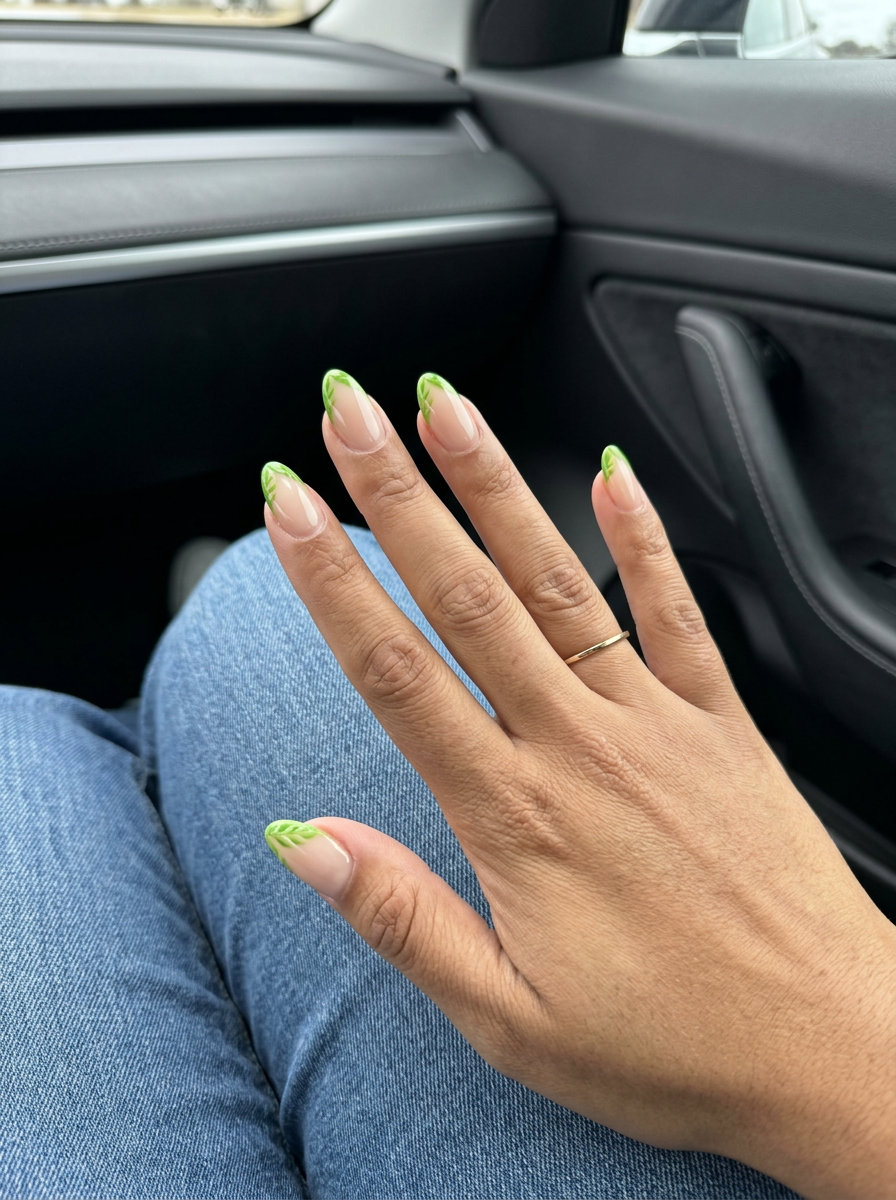 Lime green tropical leaf micro French tropical nail designs 2026, sheer nude, lime green leaf tips, work.