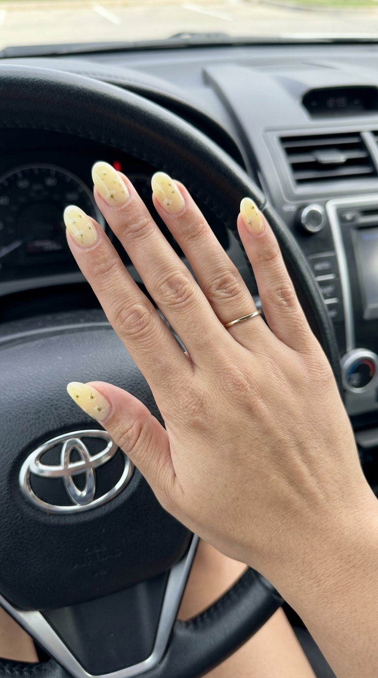 Mellow Yellow Milk Bath Blooms: Yellow Summer Nails 2026 Dreamy pale butter yellow milk bath nails with delicate florals for romantic occasions. Yellow summer nails 2026.