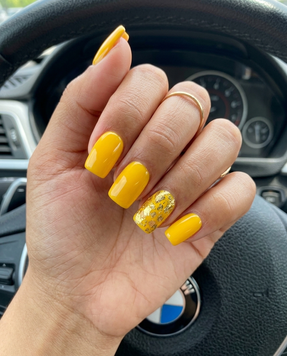 Sunflower Accent Gold Foil Nails 2026 Sunflower Accent Gold Foil nails with bright yellow gel polish and scattered gold foil for summer 2026.