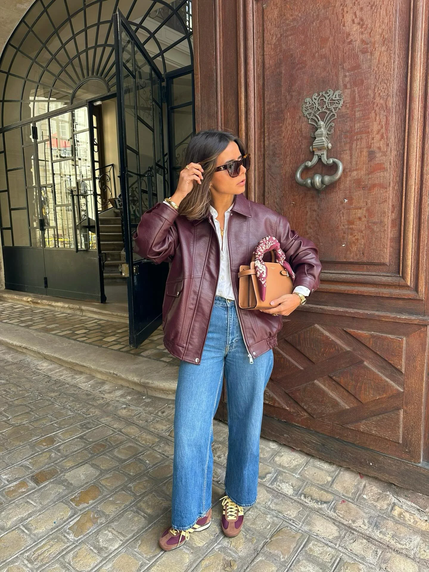 fall travel outfits for women 2026 Burgundy Leather Jacket With Vintage Denim Charm