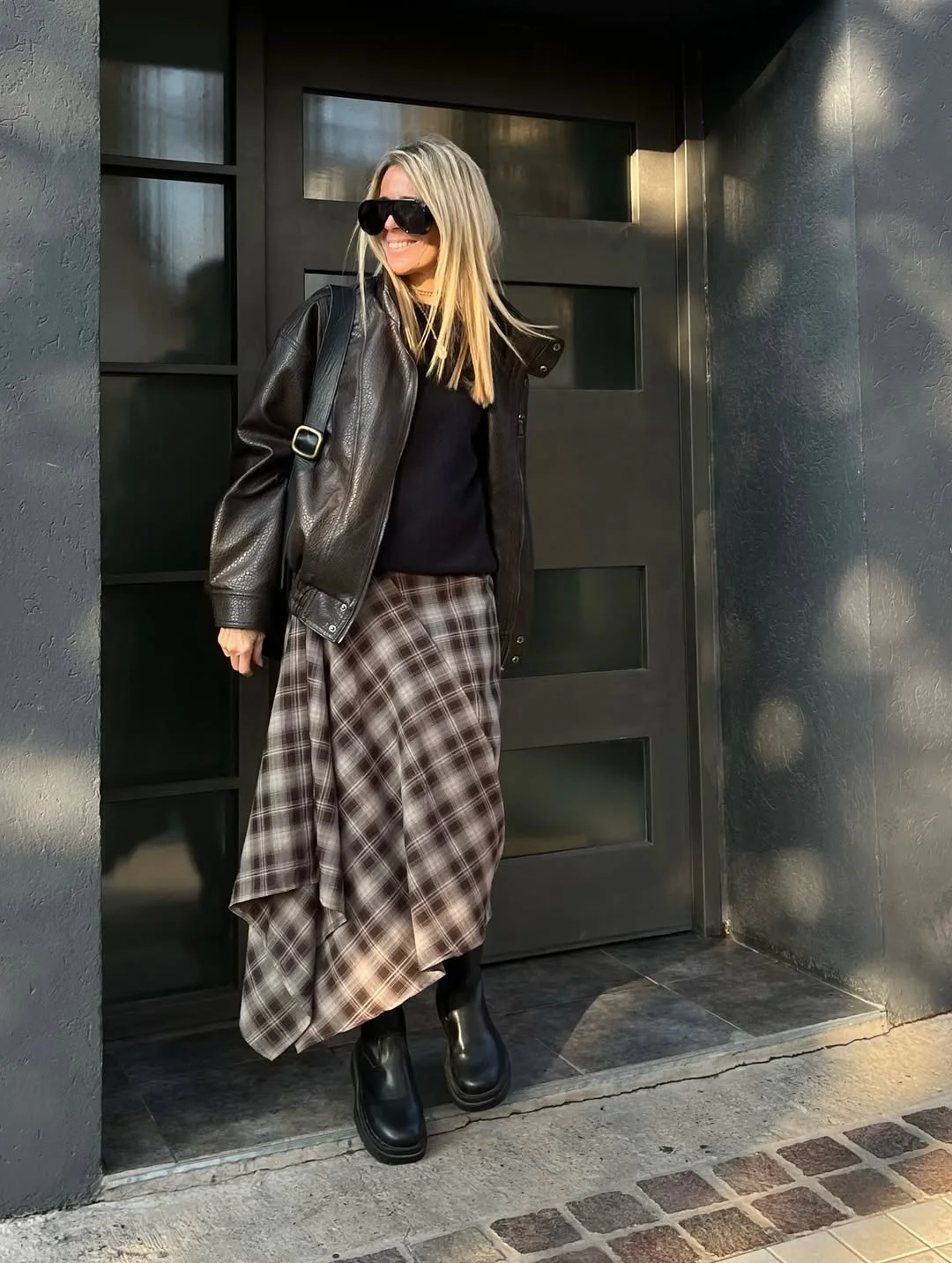 fall outfits with skirts 2026 Relaxed Plaid Skirt With A Leather Jacket And Chunky Boots