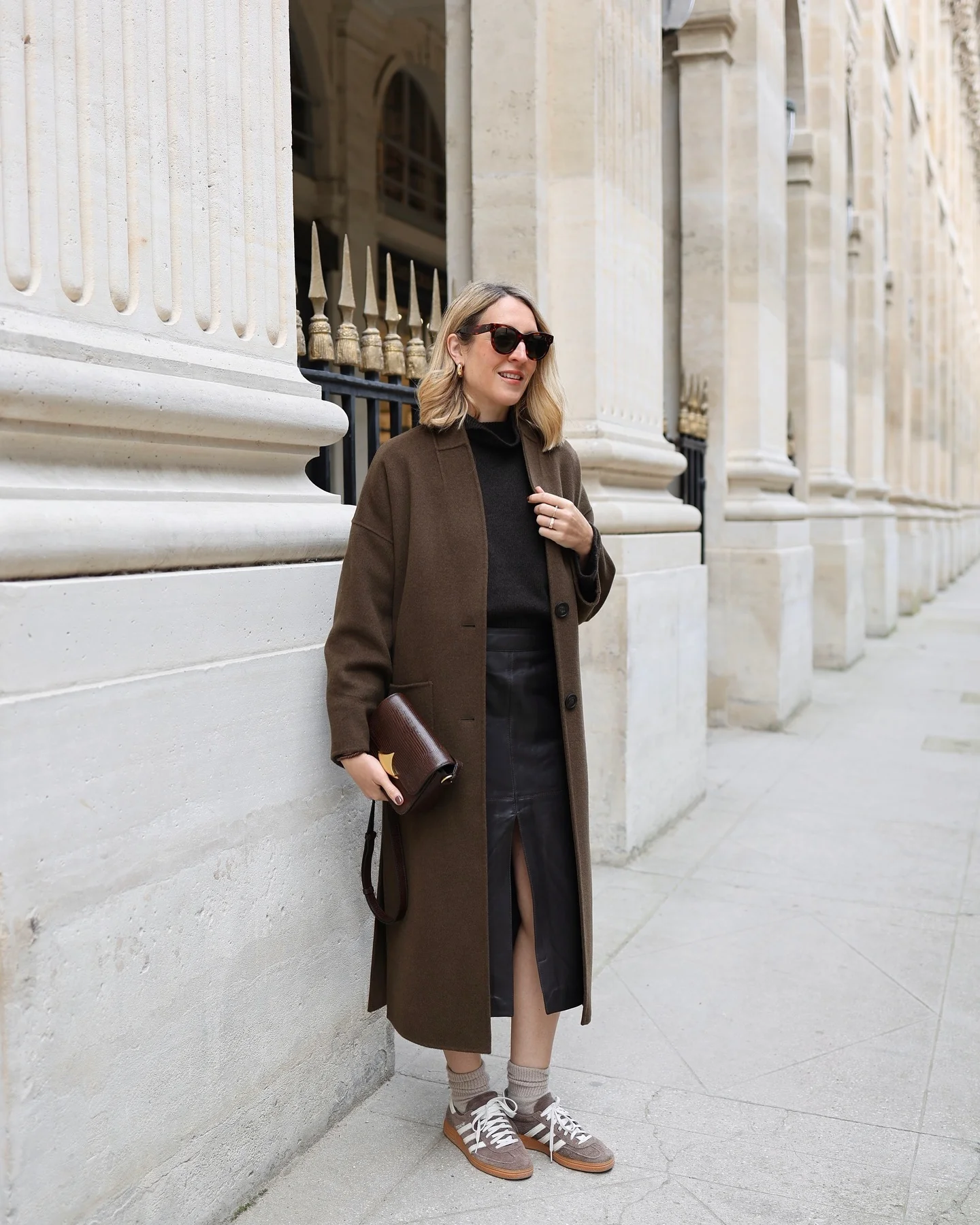fall outfits with skirts 2026 Long Brown Coat With A Leather Midi Skirt