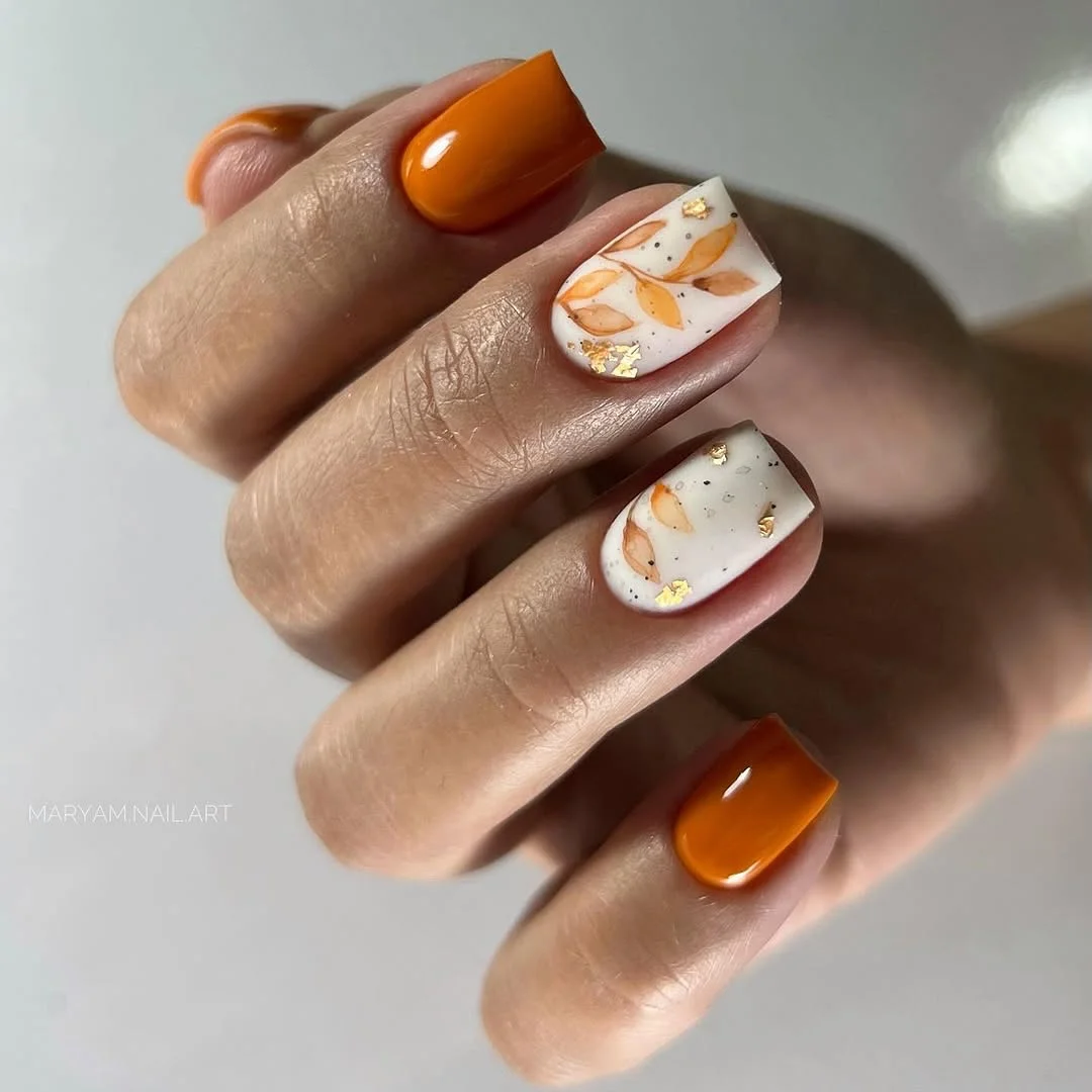 fall medium nail ideas 2026 Burnt Orange Botanical Nails With Golden Autumn Details