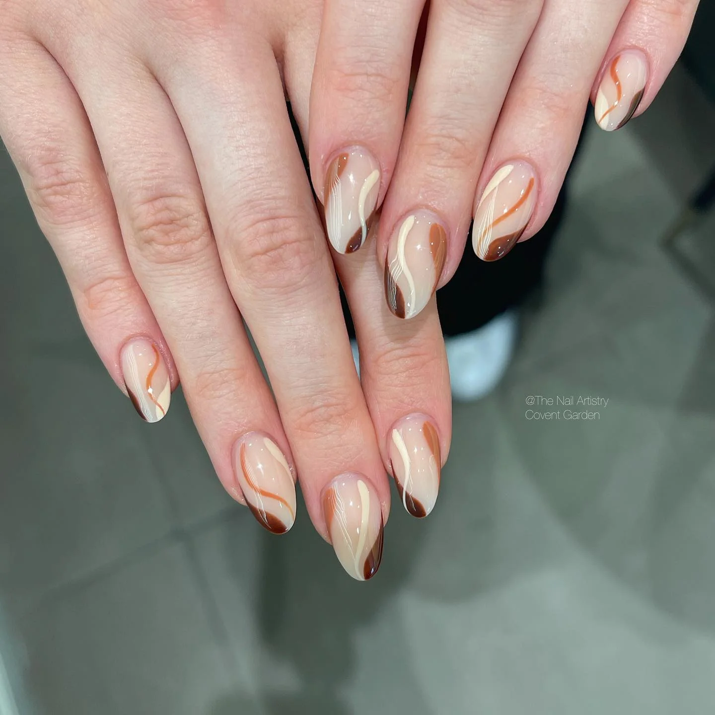 september nail designs 2026 Abstract Mocha Swirls With Soft Nude Elegance