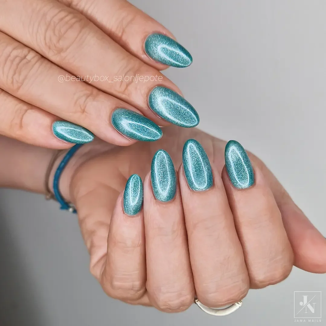 best nail colors for august 2026 Shimmering Teal Cat Eye For Late Summer Evenings