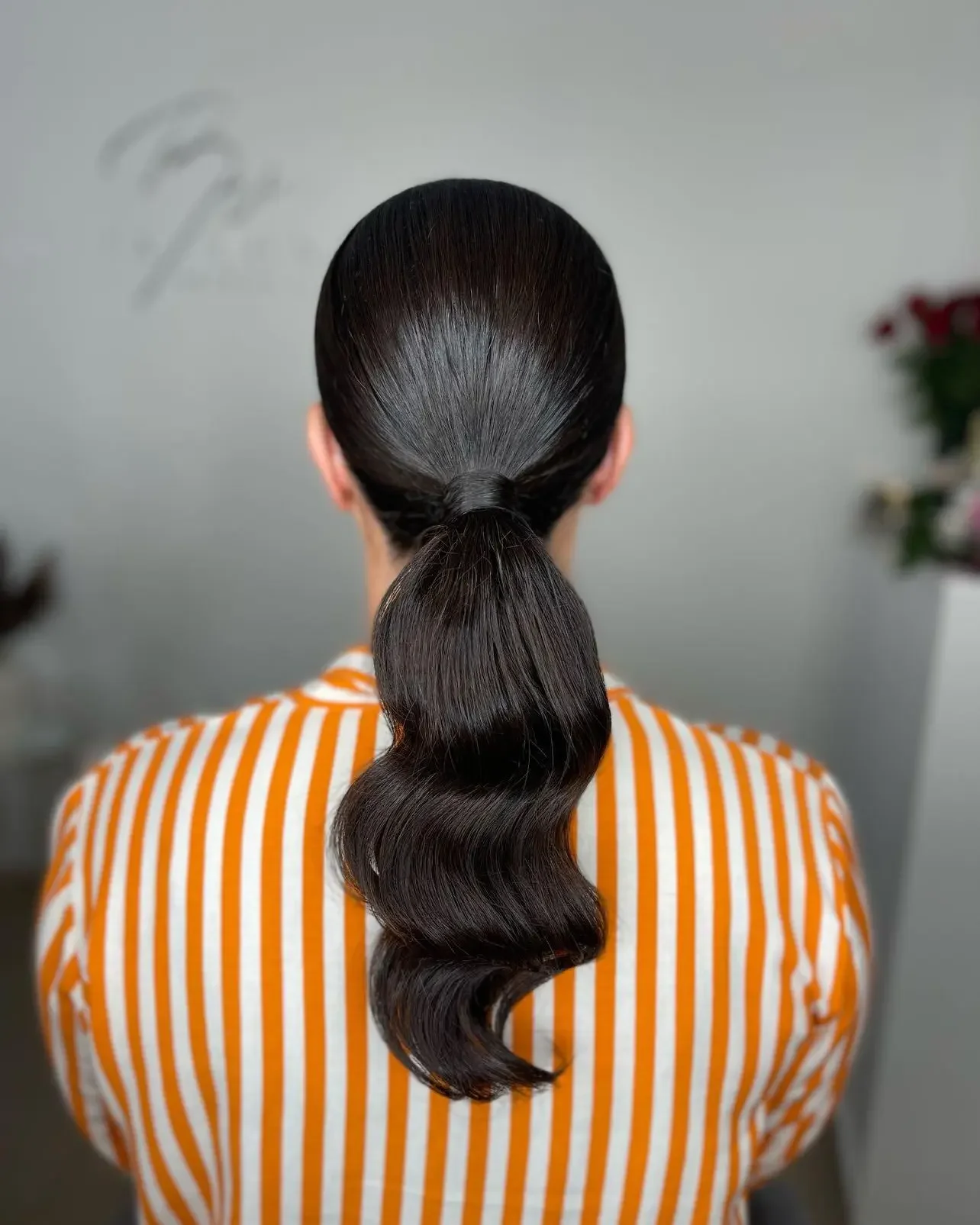 body waves hairstyle Minimalist Sleek Ponytail With Statement Body Waves