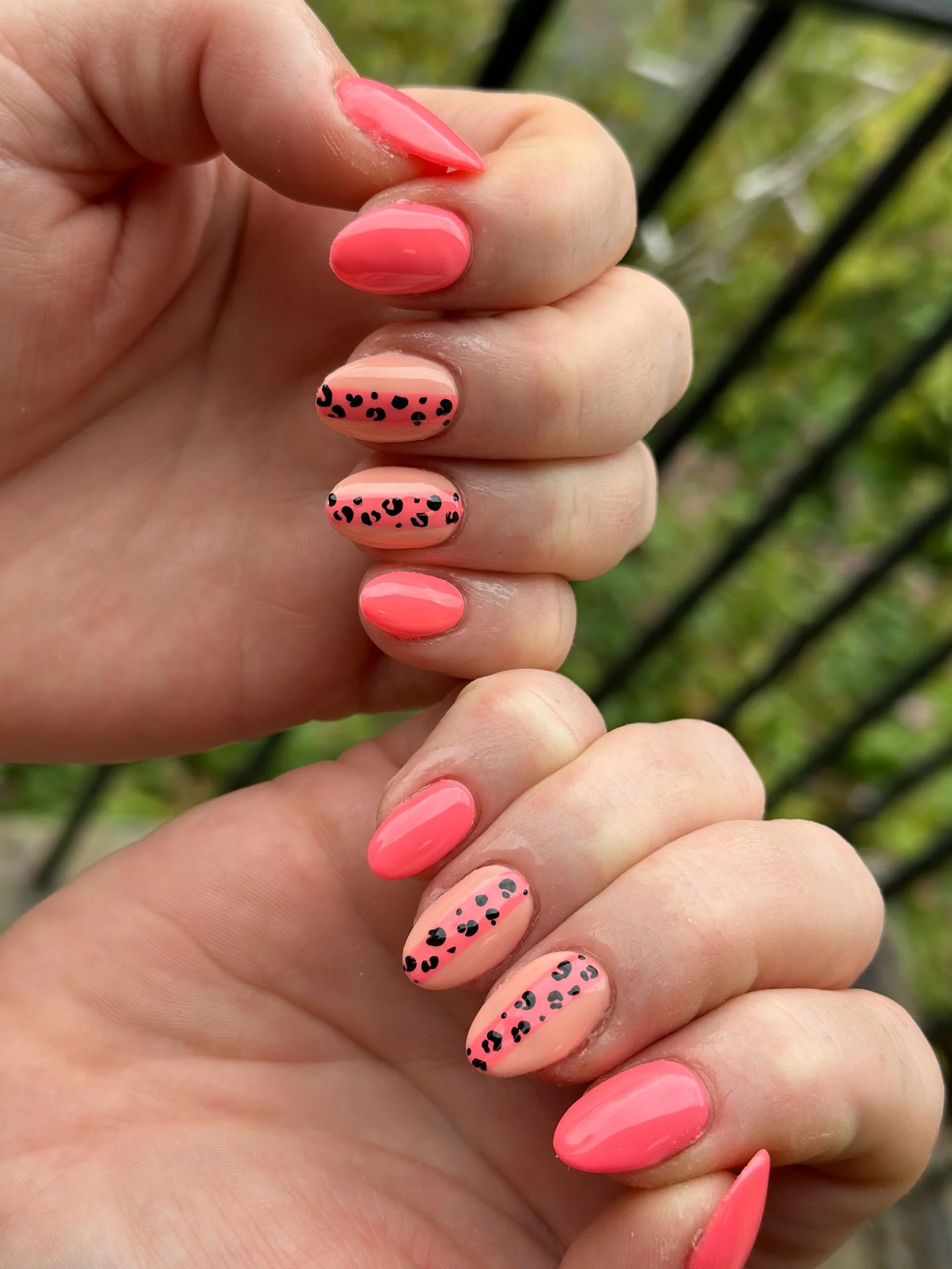 nail designs for august 2026 Coral Pink Nails With Chic Leopard Accent Art