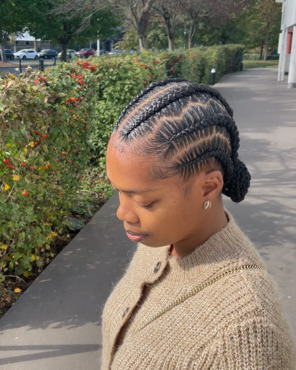 feed in braid hairstyles Elegant Low Feed-In Braided Bun With Clean Side Cornrows