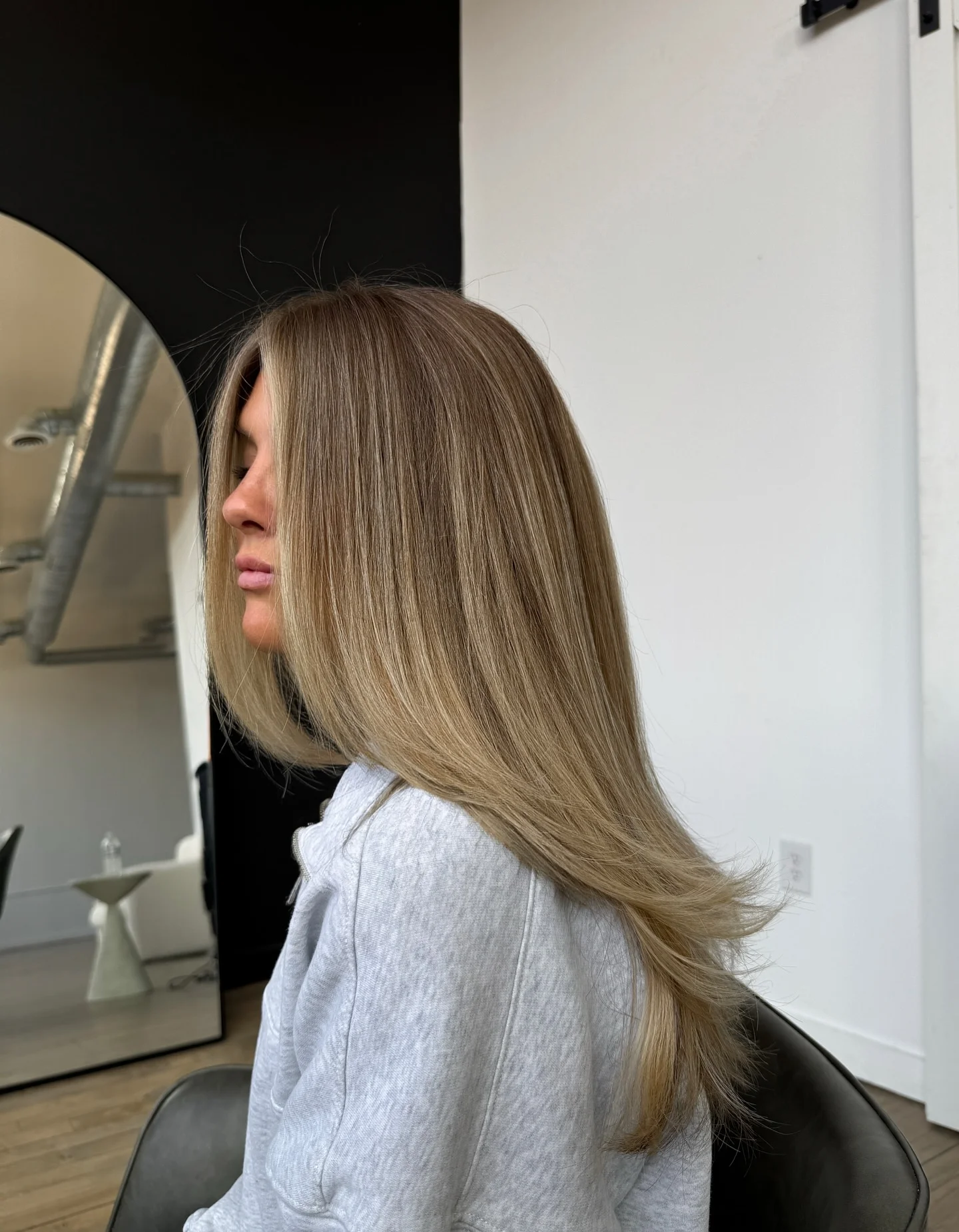 dirty blonde hair color Long Feathered Layers With Soft Blonde Balayage
