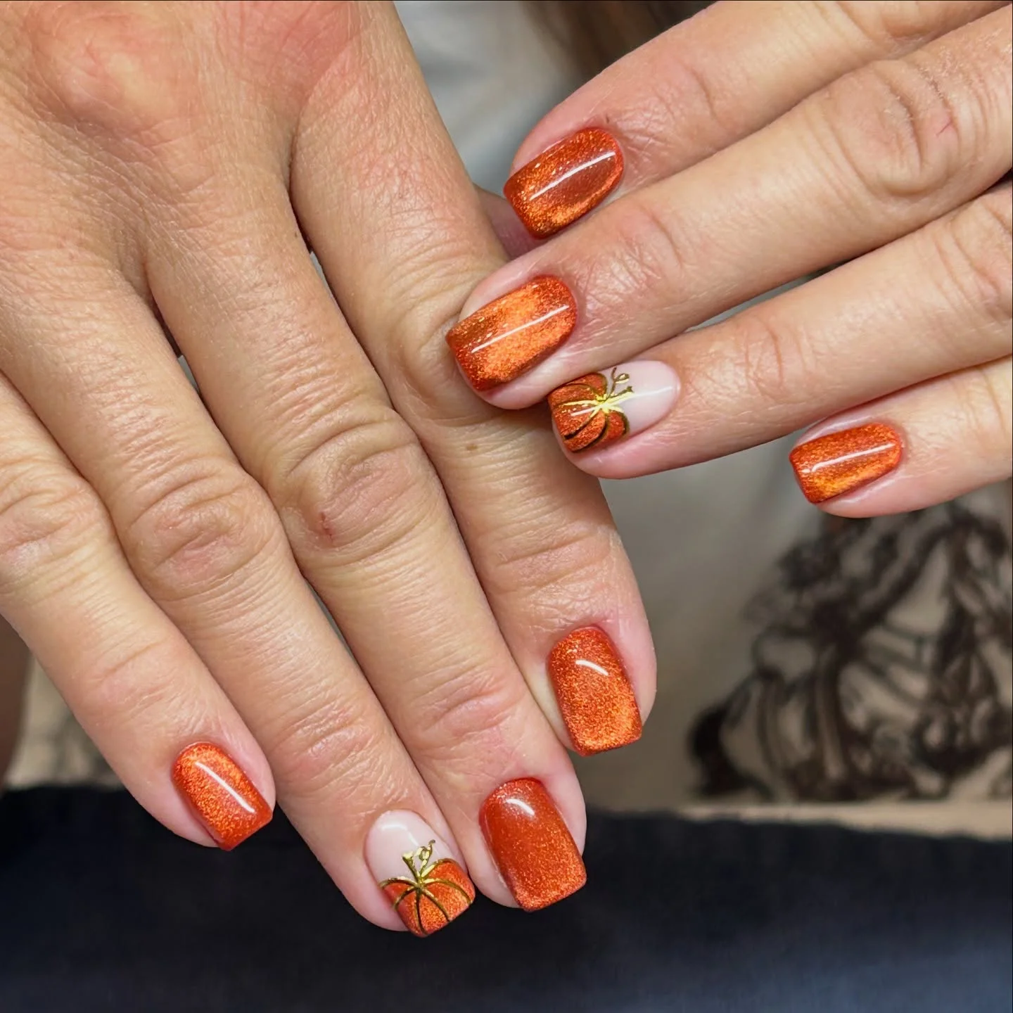fall manicure 2026 Shimmering Pumpkin Orange Nails With Cozy Autumn Accent
