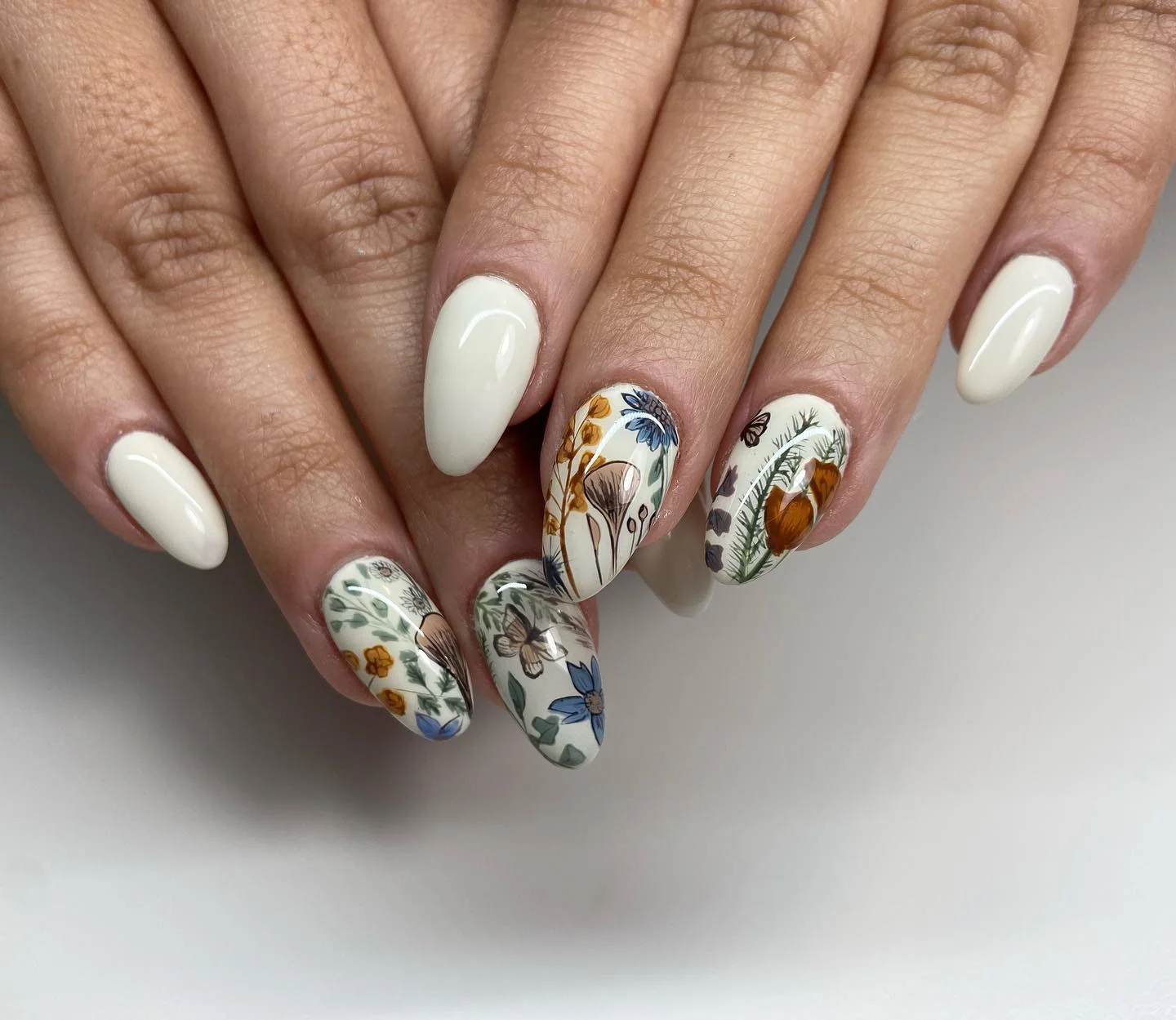 september nail art ideas 2026 Soft Botanical Almond Nails In Neutral Autumn Tones