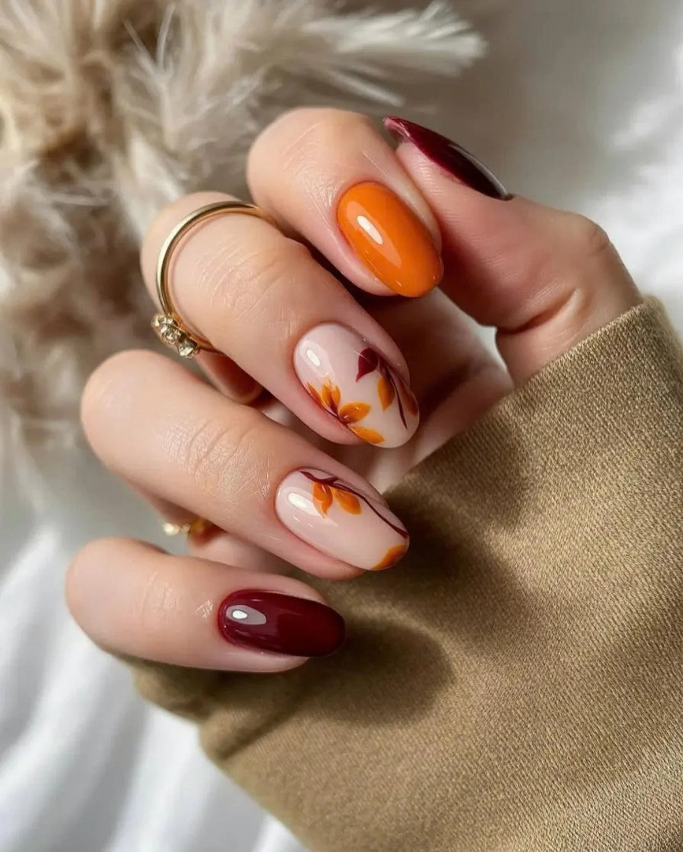 fall nail for all plates skin 2026 Burnt Orange Botanical Nails For Cozy Autumn Days