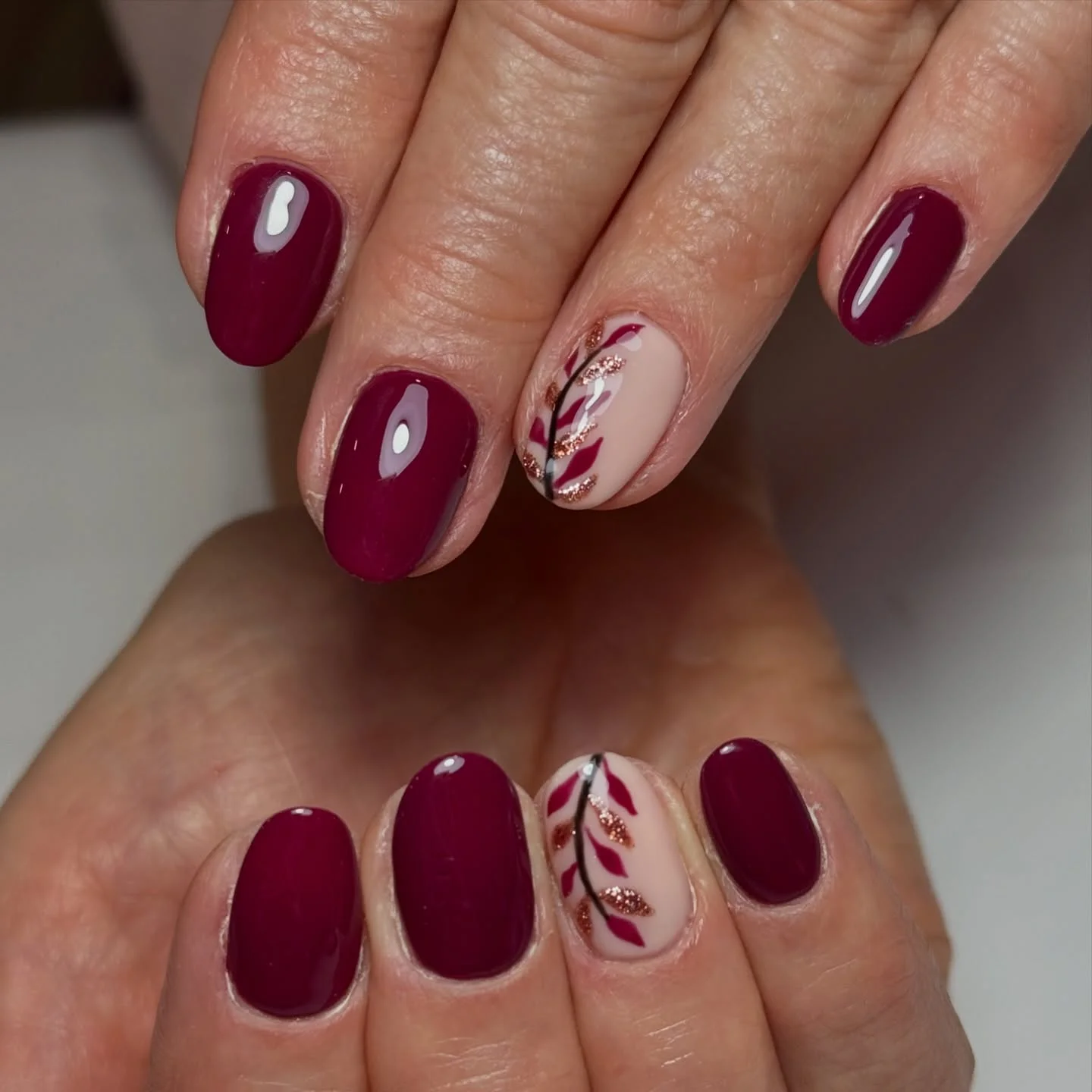 september nail designs 2026 Deep Berry Botanical Manicure With Rose Gold Details