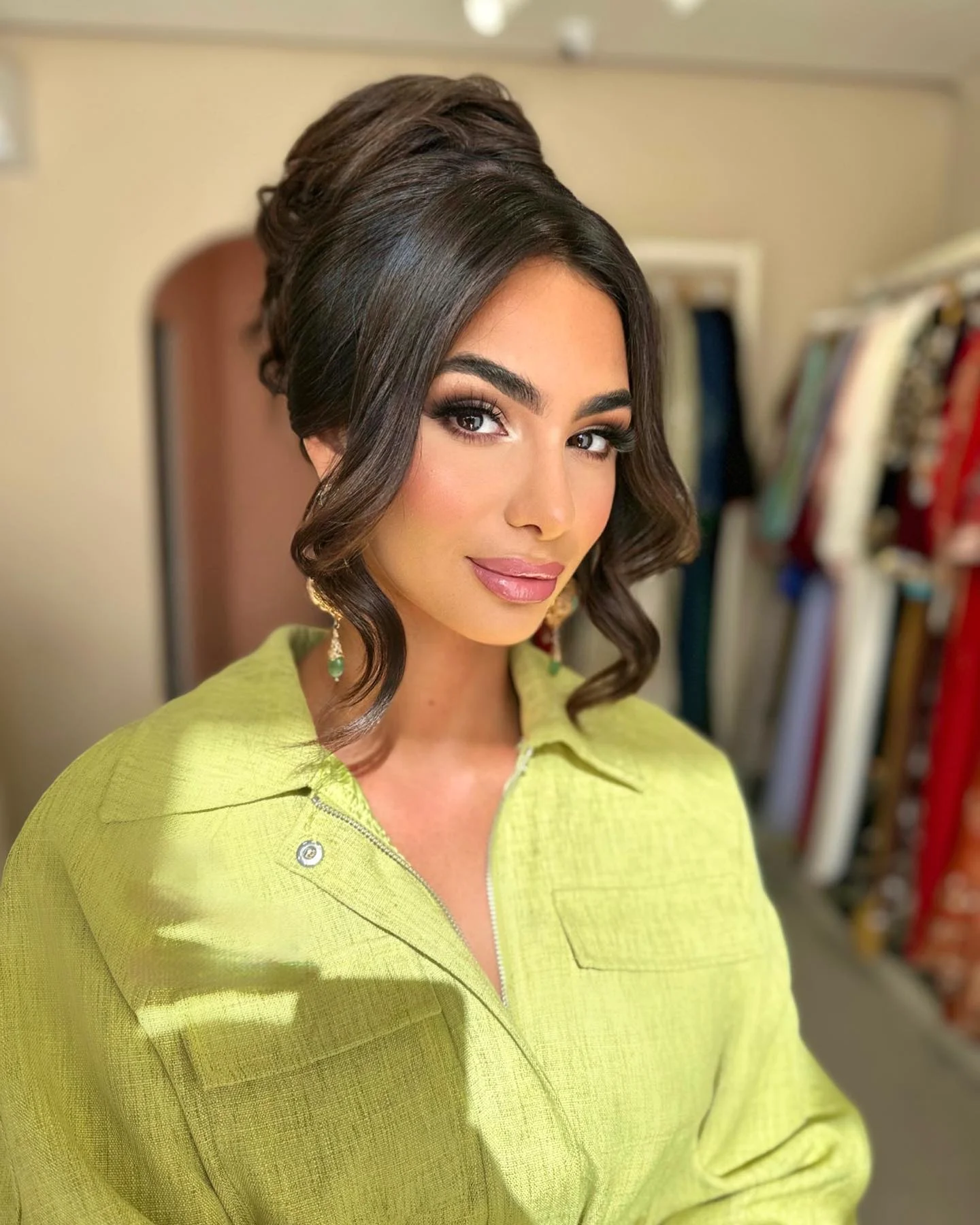 september hairstyles ideas 2026 Classic Voluminous Bun With Soft Face-Framing Curls