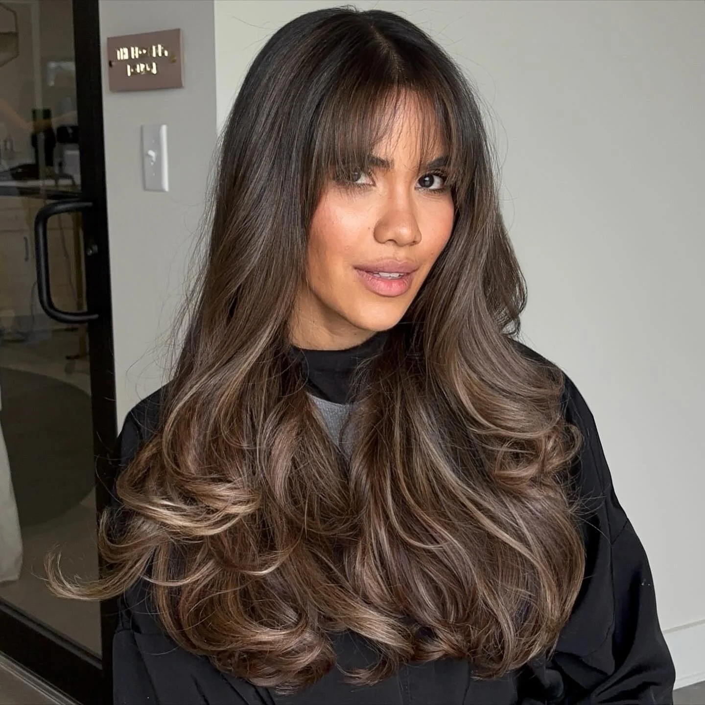 dimensional brunette hair color Ash Mocha Brunette With Airy Curtain Fringe