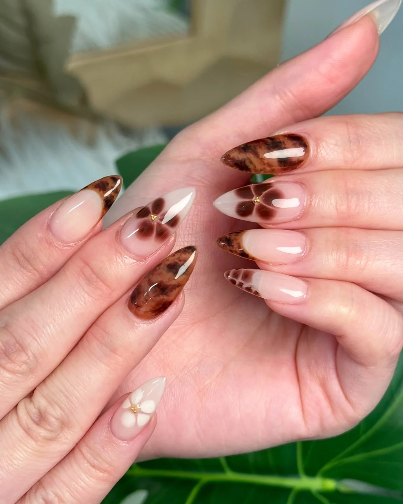 fall nail for all plates skin 2026 Tortoiseshell Almond Nails With Soft Floral Details