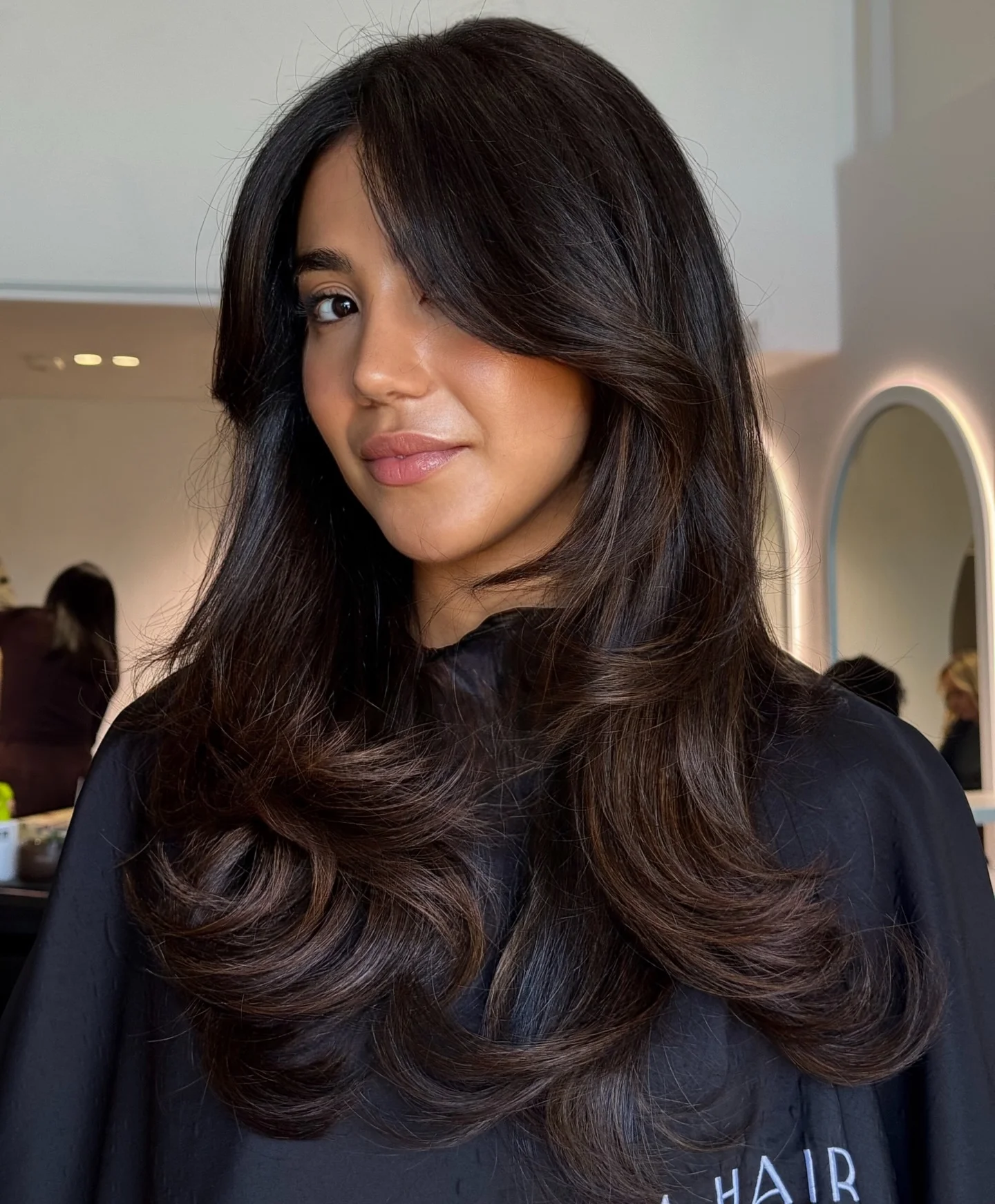 dimensional brunette hair color Glossy Espresso Layers With Soft Curtain Framing