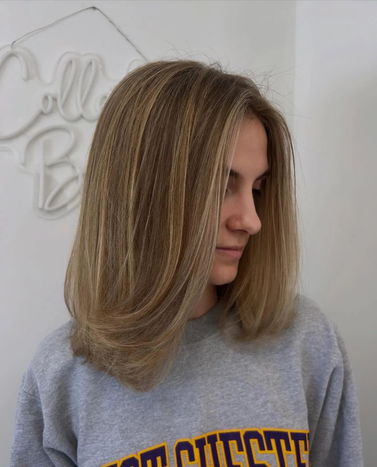 dirty blonde hair color Polished Shoulder-Length Blowout With Soft Face-Framing Brightness
