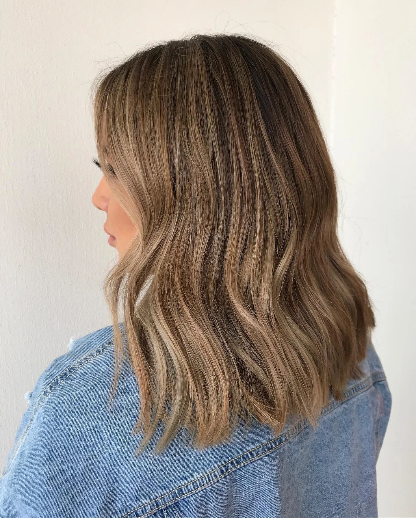 dirty blonde hair color Textured Mid-Length Waves With Soft Dirty Blonde Balayage