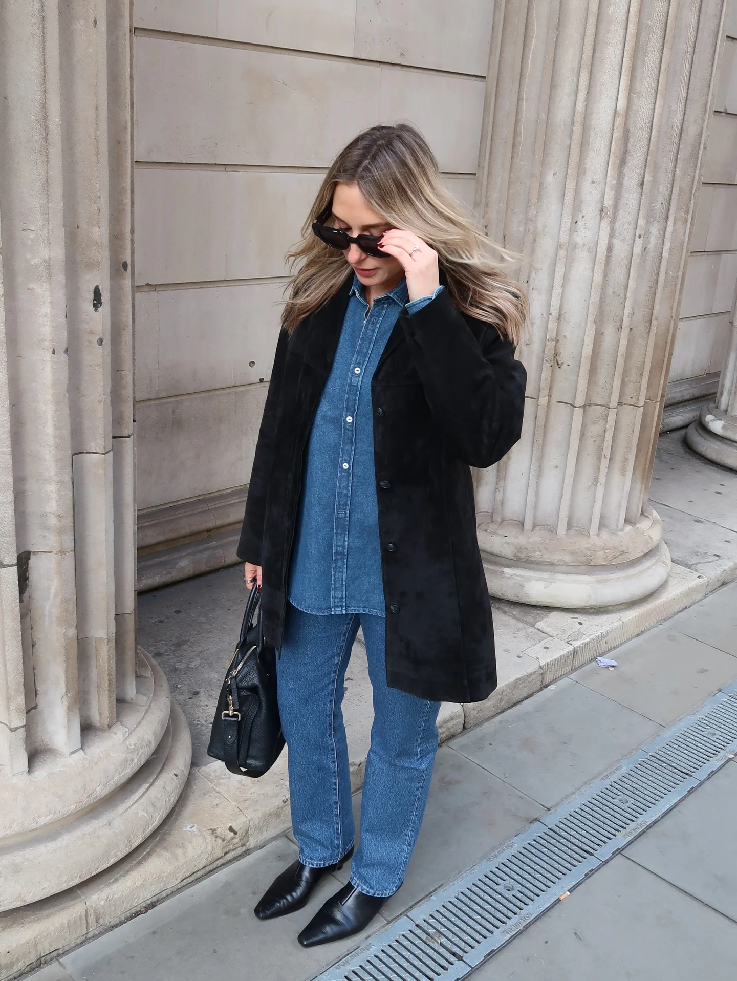 fall outfits with ankle boots 2026 Double Denim Styled With A Sleek Black Coat