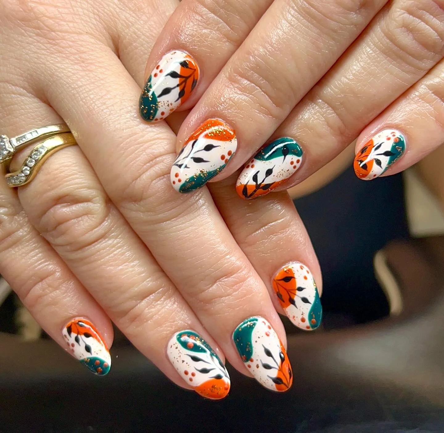 september nail art ideas 2026 Modern Teal And Orange Botanical Nails