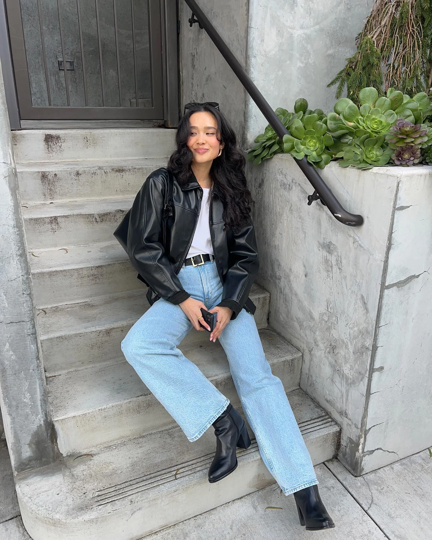 best fall outfits for women 2026 Relaxed Black Leather Jacket And Light Wash Denim