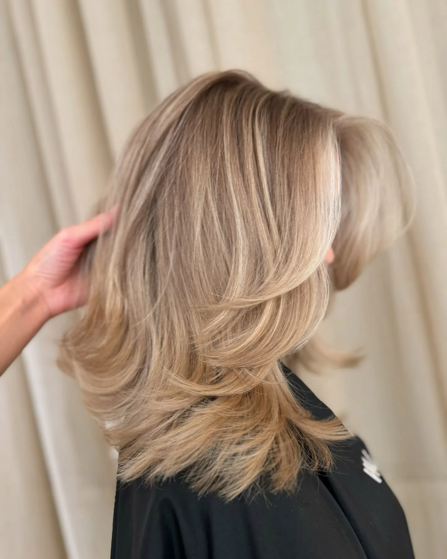 dirty blonde hair color Feathered Mid-Length Cut With Airy Blonde Balayage