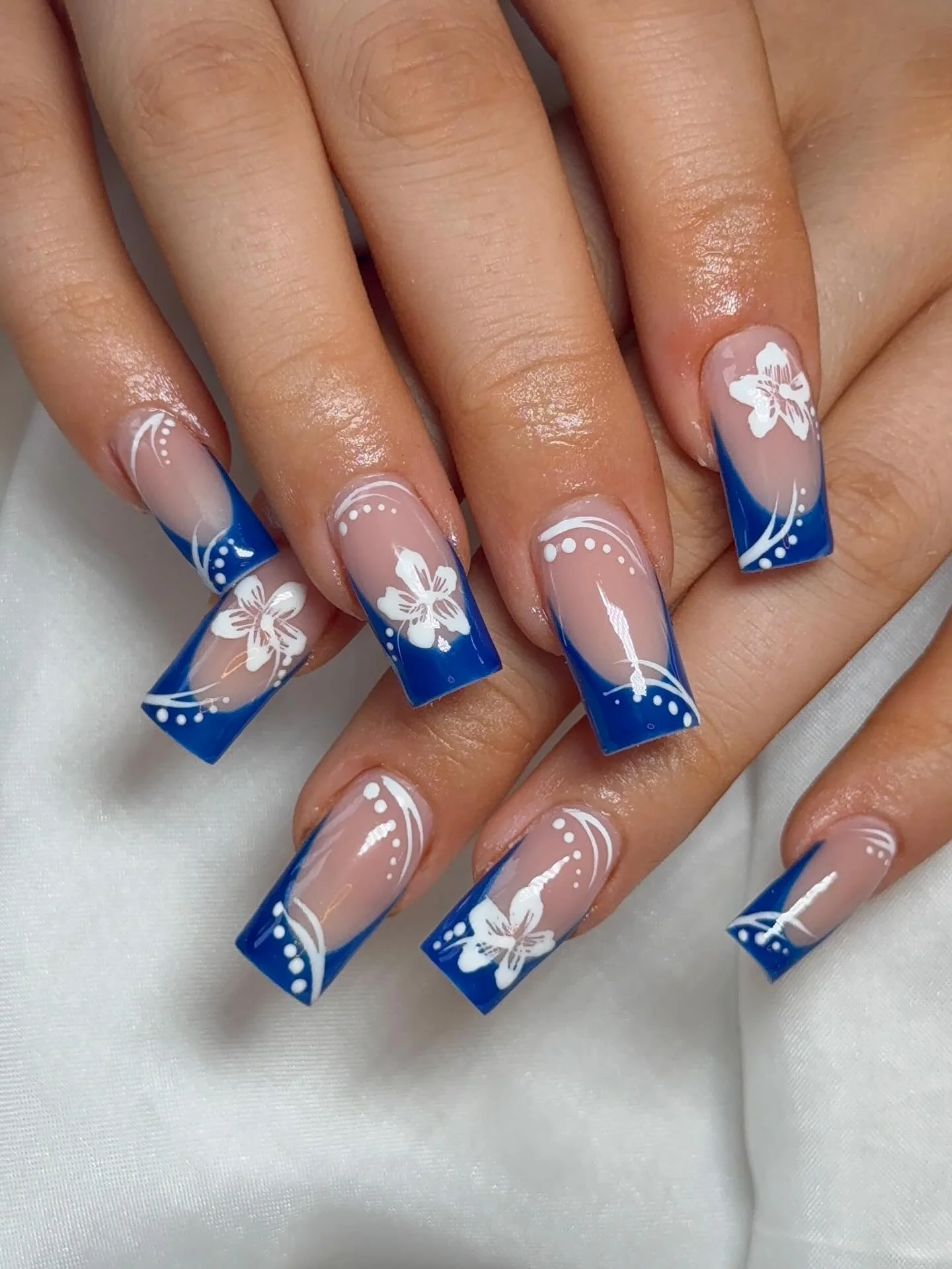 nail designs for august 2026 Royal Blue Floral Square Nails With Elegant French Lines
