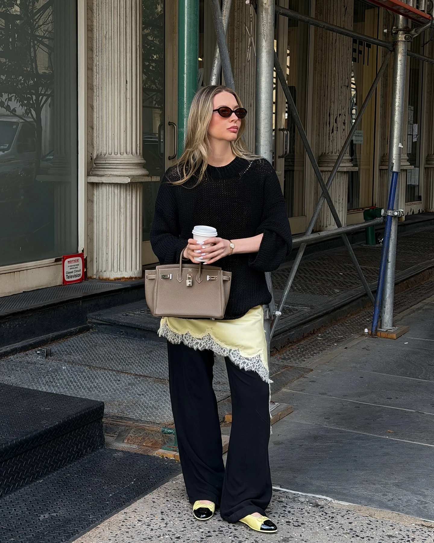 lace layering fall outfit 2026 Soft Yellow Lace With Oversized Black Knitwear