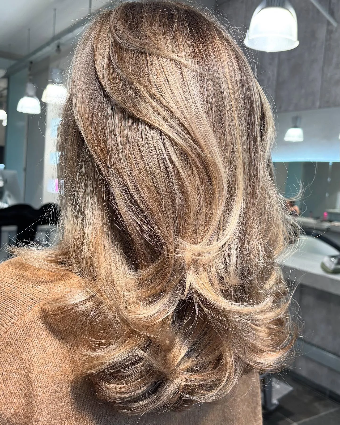 dirty blonde hair color Long Flowing Layers With Seamless Blonde Highlights