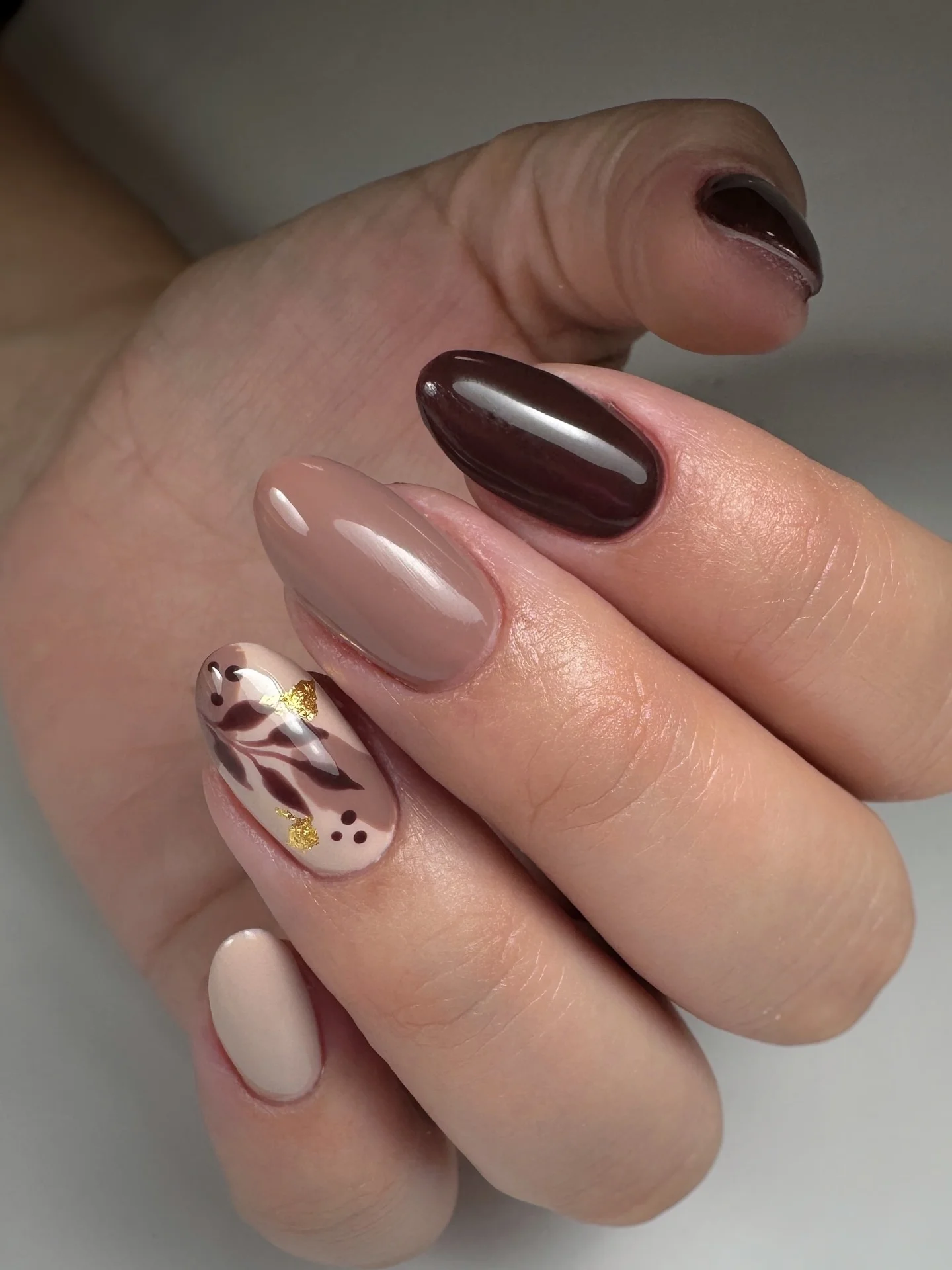 fall manicure 2026 Chocolate Brown Elegance With Delicate Floral Accent
