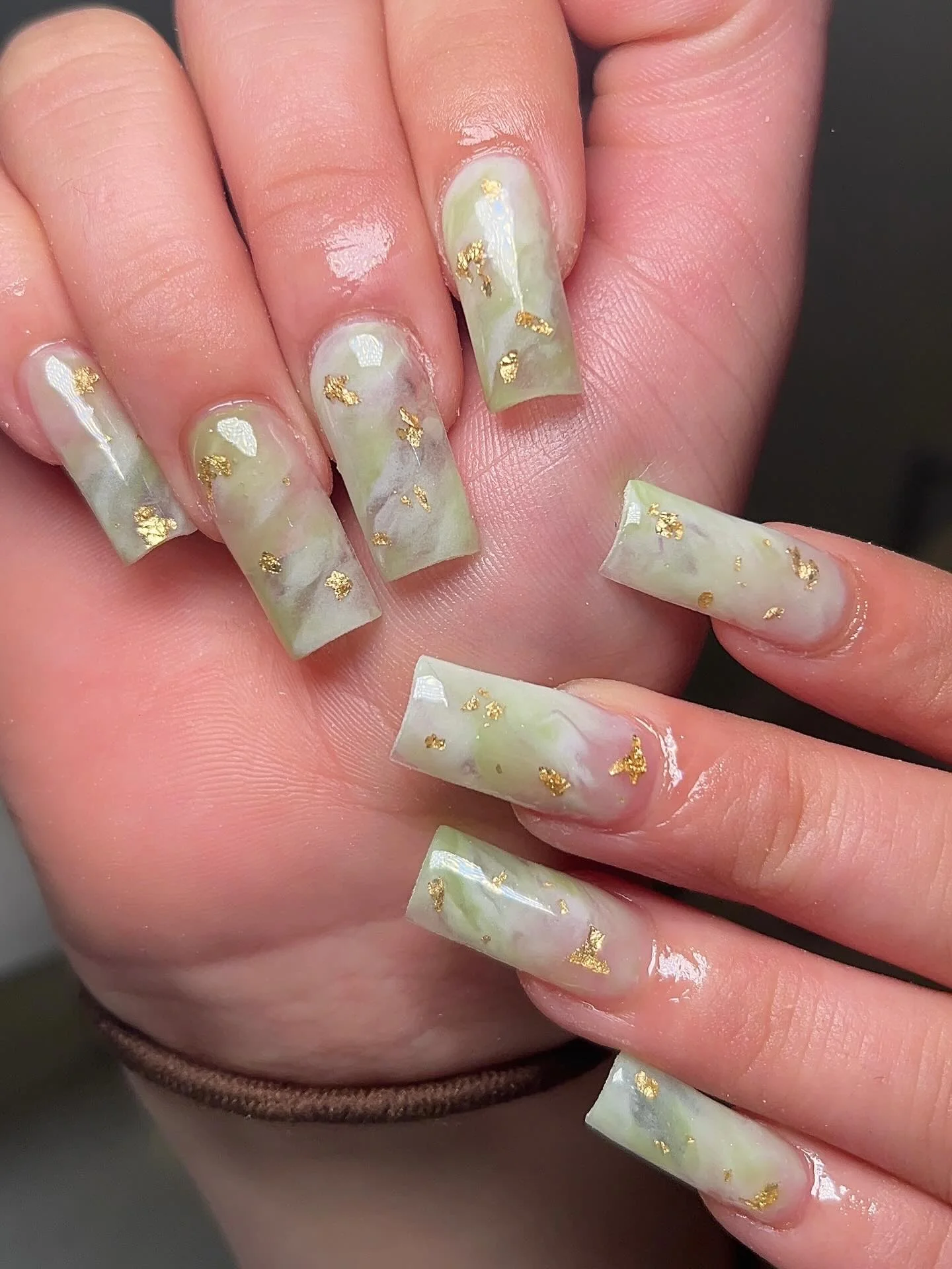 fall acrylic nails 2026 Soft Sage Marble Acrylic Nails With Gold Foil